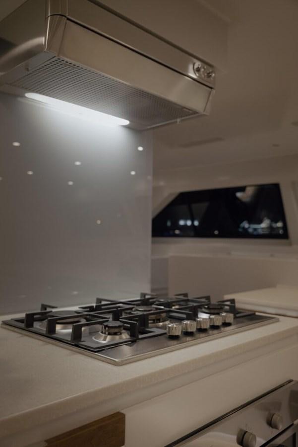 a white stove with a light on top aboard SALTY Yacht for Sale