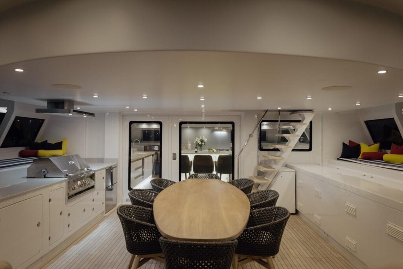 a large kitchen with a dining area aboard SALTY Yacht for Sale