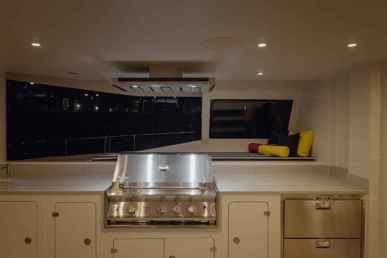 a kitchen with a stove and oven aboard SALTY Yacht for Sale