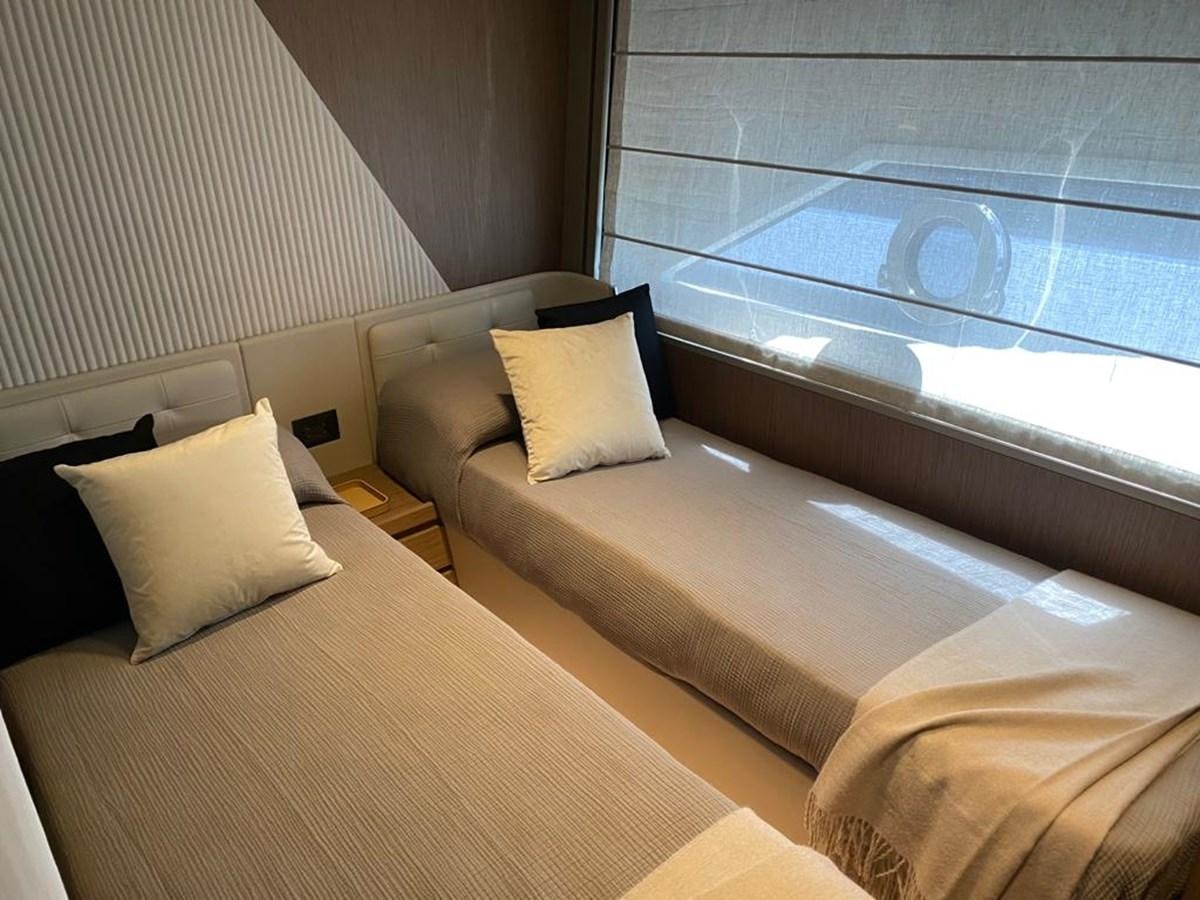 a bed with a window aboard MY ANGEL Yacht for Sale