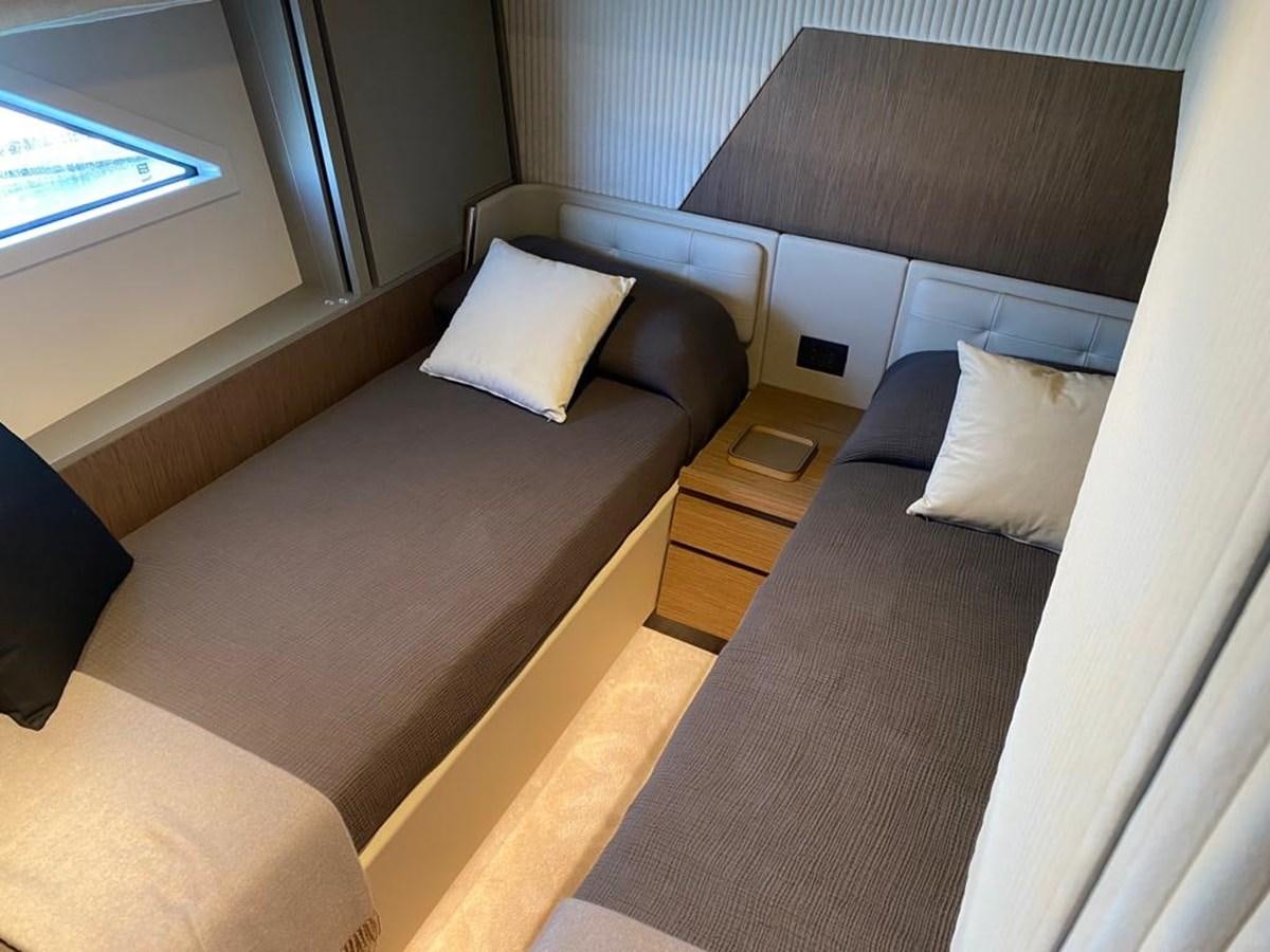 a bed with a wooden headboard aboard MY ANGEL Yacht for Sale