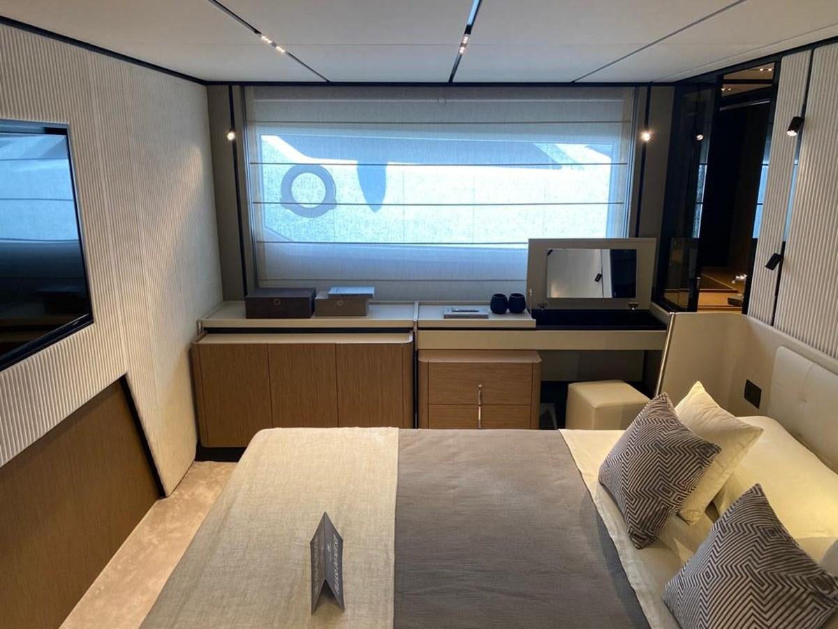 a room with a bed and a tv on the wall aboard MY ANGEL Yacht for Sale