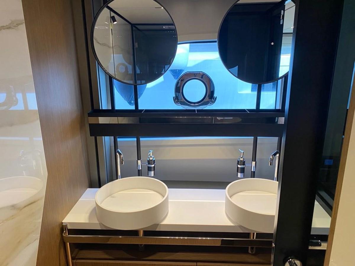 a bathroom with sinks and mirrors aboard MY ANGEL Yacht for Sale