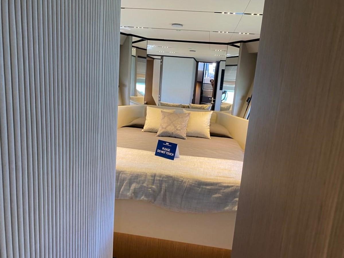 a bed with a blue box on the side aboard MY ANGEL Yacht for Sale