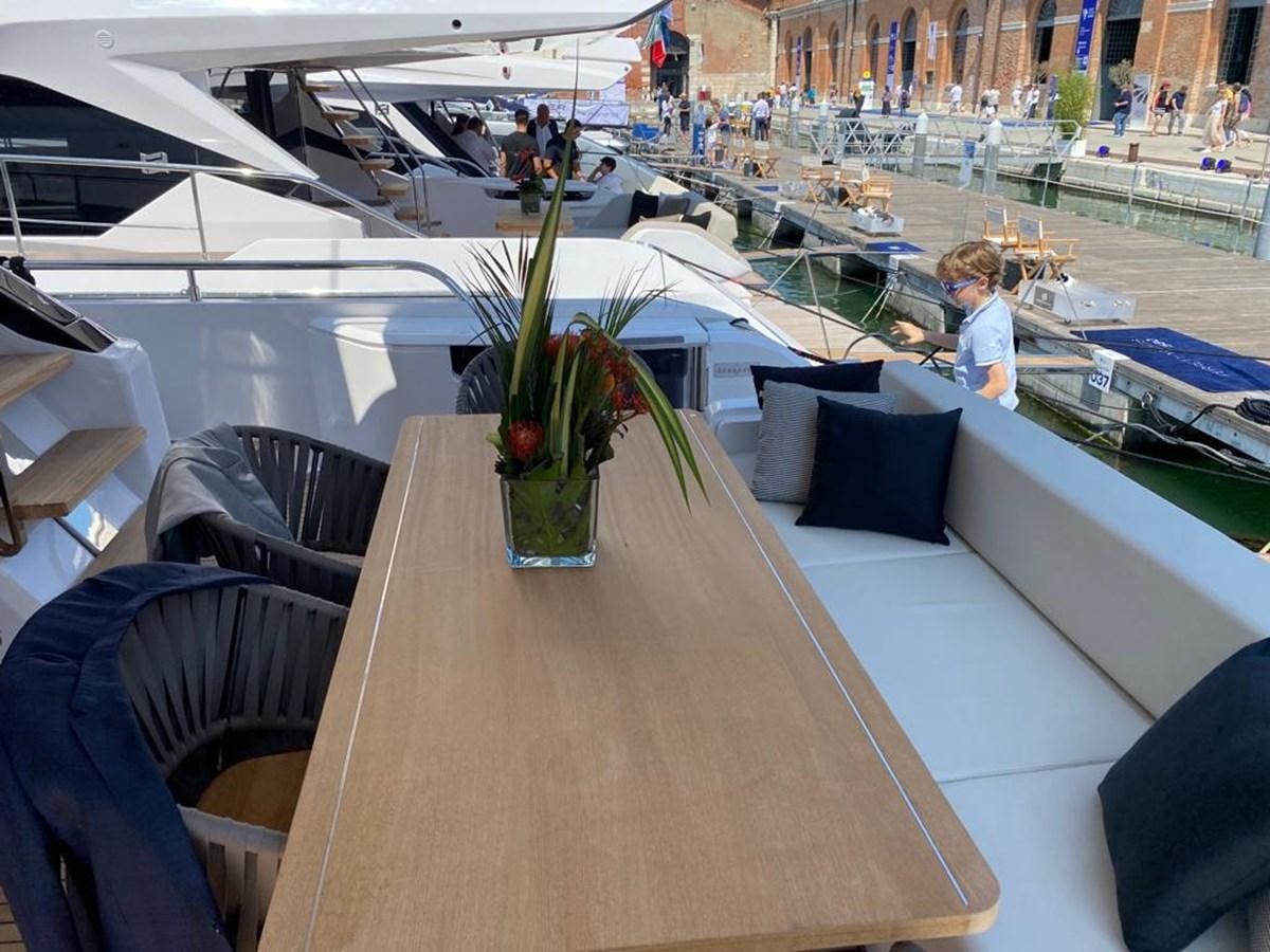 a person sitting at a table aboard MY ANGEL Yacht for Sale