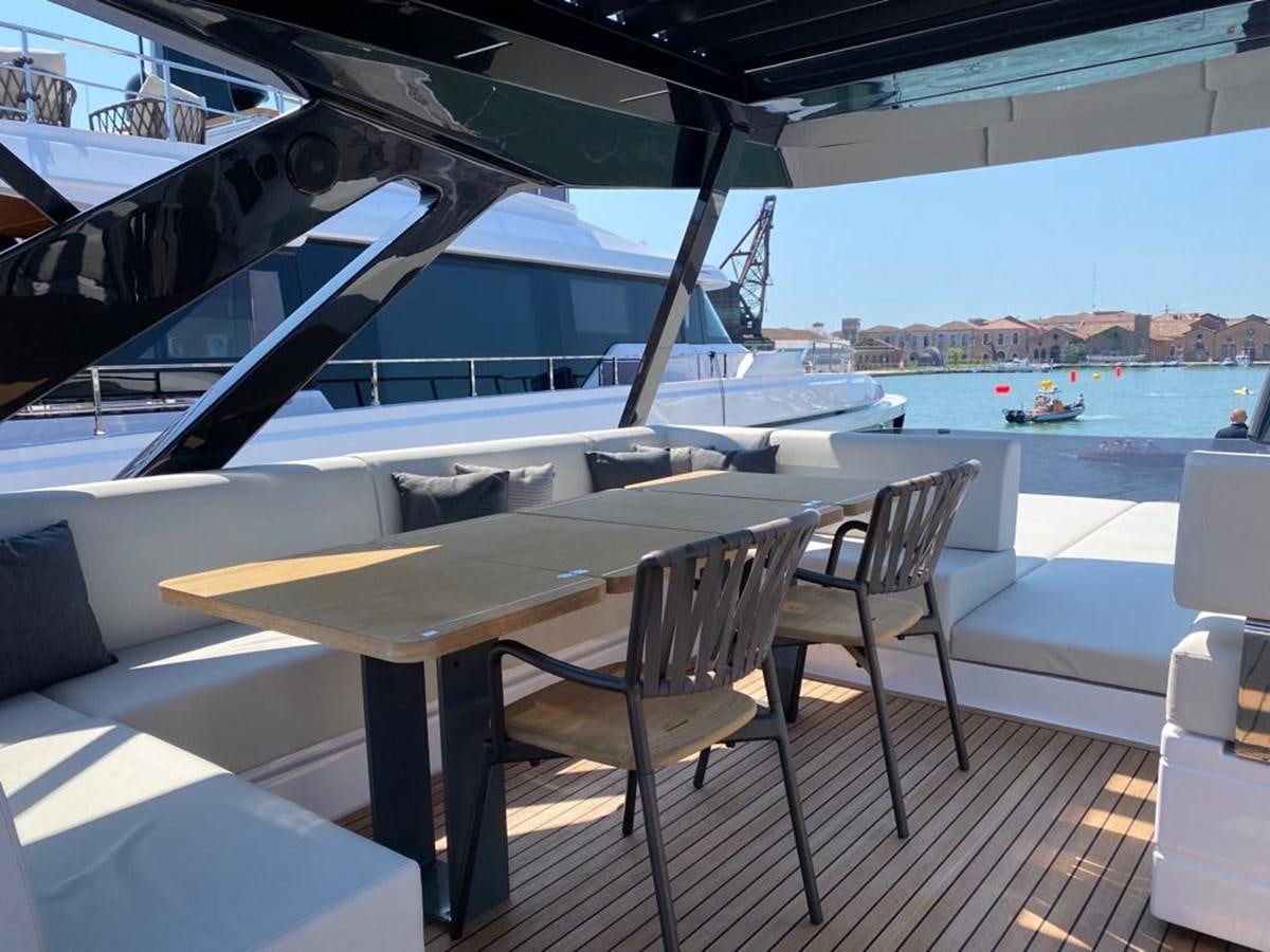 a table and chairs on a deck aboard MY ANGEL Yacht for Sale