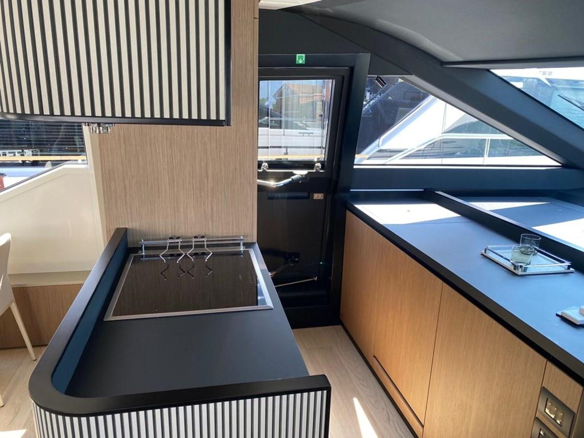 a room with a table and a window aboard MY ANGEL Yacht for Sale