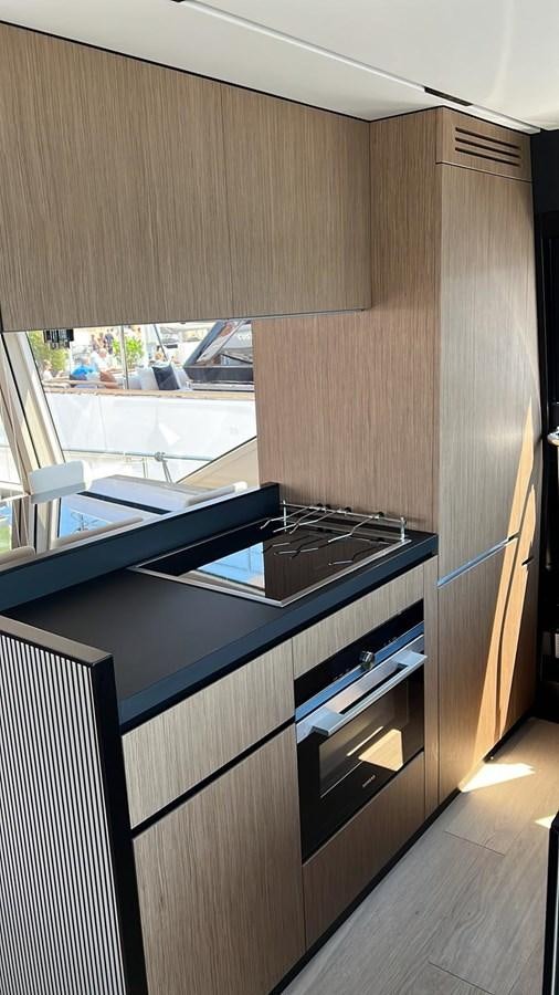a kitchen with a stove and cabinets aboard MY ANGEL Yacht for Sale