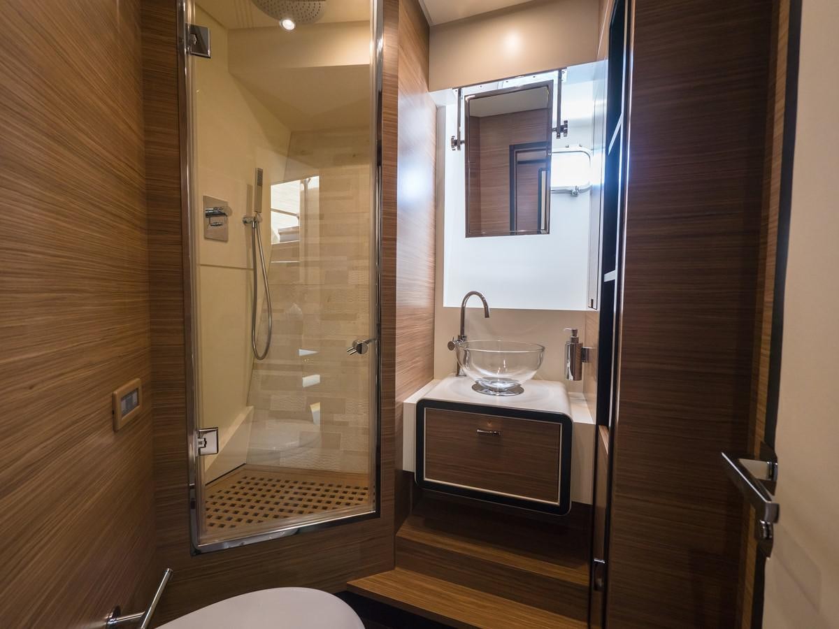 a bathroom with a glass shower aboard 2016 AZIMUT 76 MAGELLANO THE EQUITES Yacht for Sale
