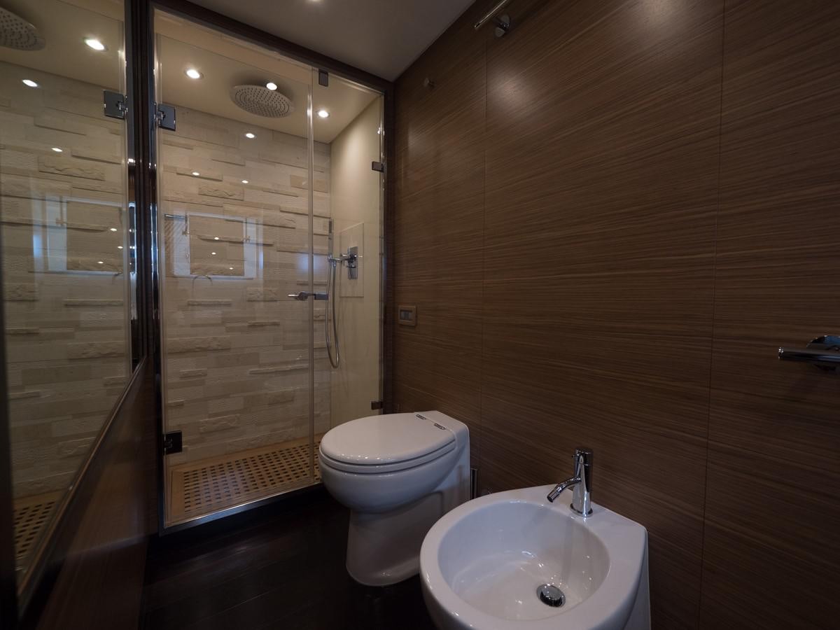 a bathroom with a glass shower door aboard 2016 AZIMUT 76 MAGELLANO THE EQUITES Yacht for Sale