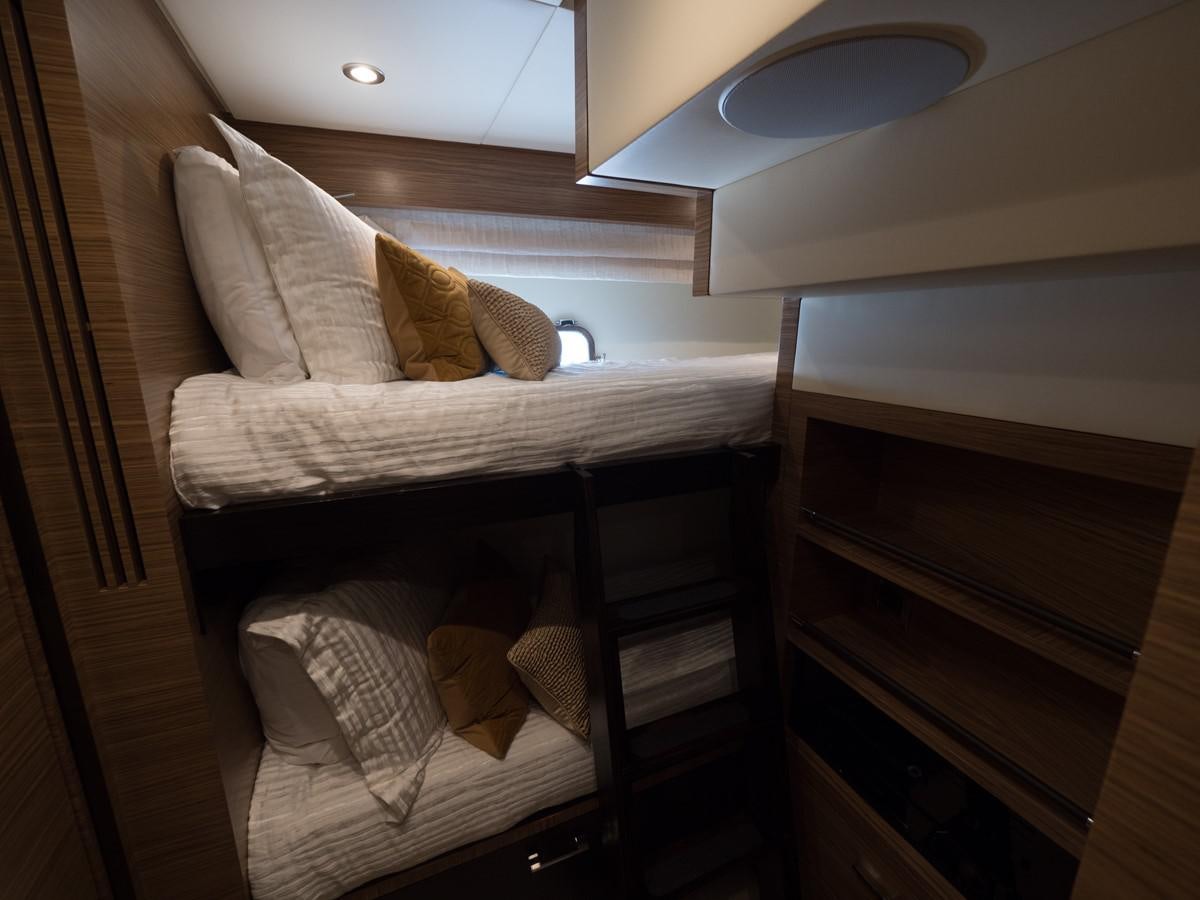 a bed with a white pillow aboard 2016 AZIMUT 76 MAGELLANO THE EQUITES Yacht for Sale