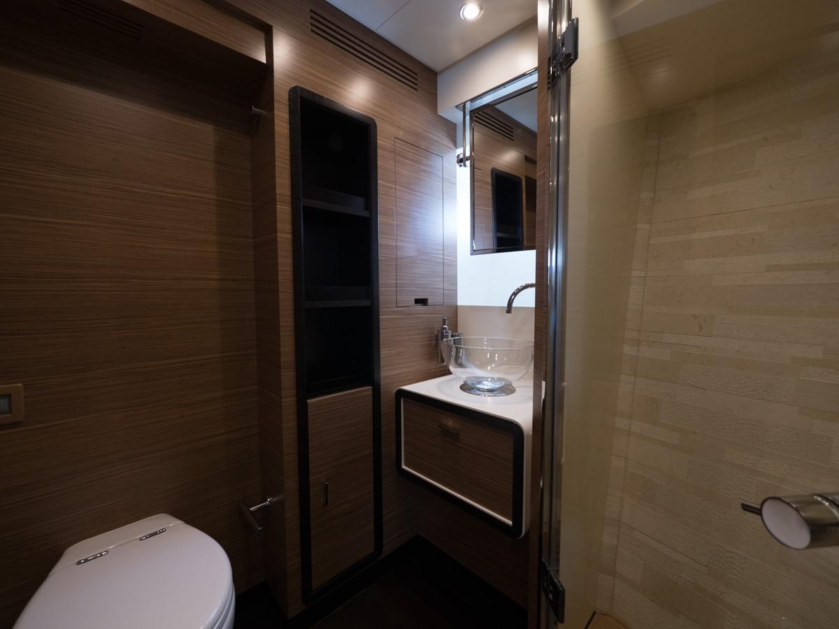 a bathroom with a sink and a toilet aboard 2016 AZIMUT 76 MAGELLANO THE EQUITES Yacht for Sale