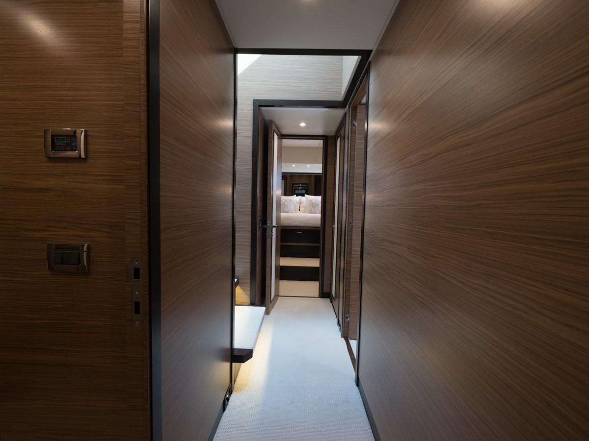 a hallway with doors aboard 2016 AZIMUT 76 MAGELLANO THE EQUITES Yacht for Sale