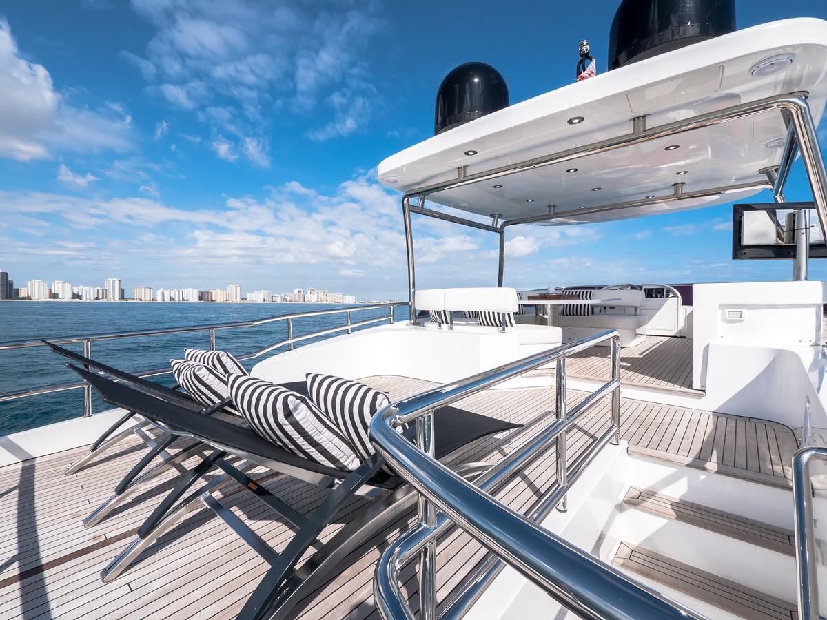 a deck with a large boat and a person on it aboard 2016 AZIMUT 76 MAGELLANO THE EQUITES Yacht for Sale