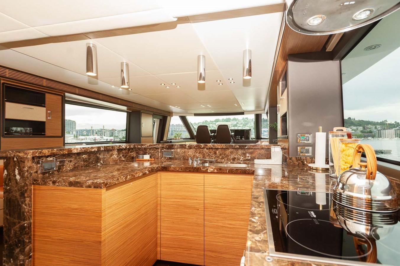 a kitchen with a large countertop aboard 2016 AZIMUT 76 MAGELLANO THE EQUITES Yacht for Sale