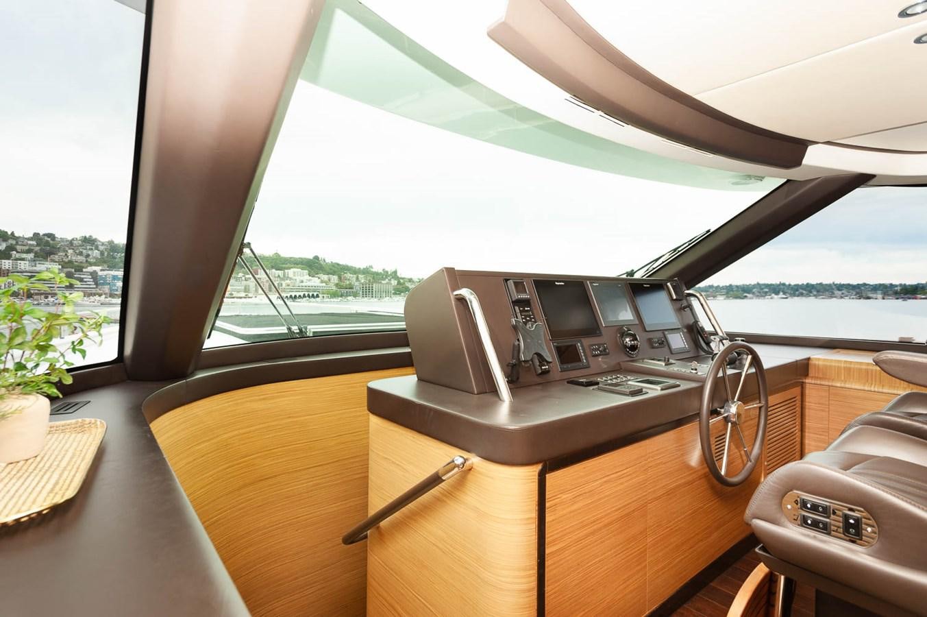 a boat with a radio and a table aboard 2016 AZIMUT 76 MAGELLANO THE EQUITES Yacht for Sale