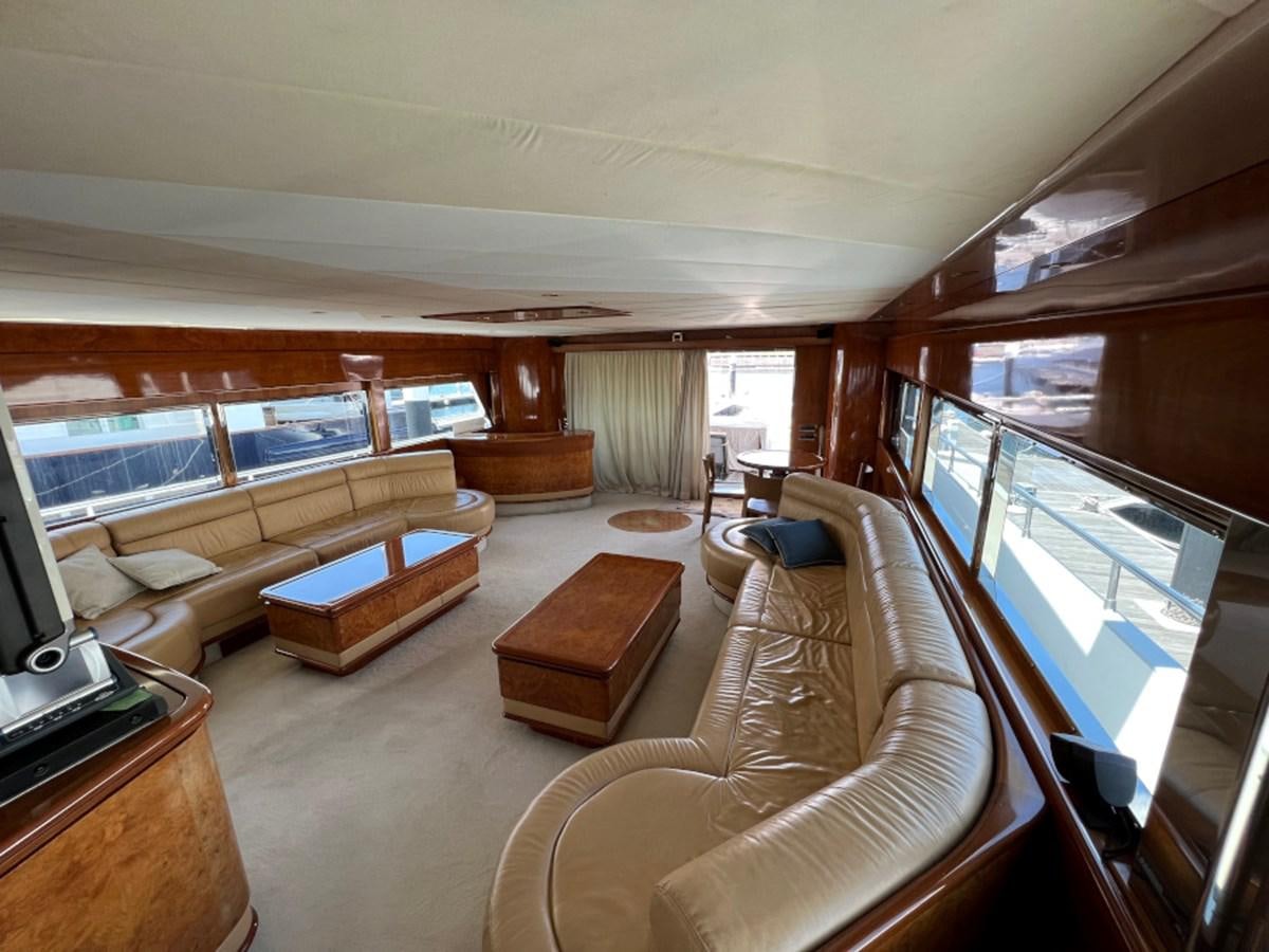 a living room with a large window aboard BENSHIP 101 Yacht for Sale