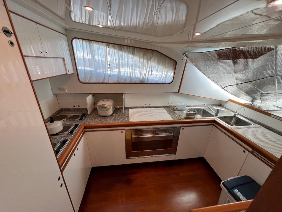 a kitchen with a sink and cabinets aboard BENSHIP 101 Yacht for Sale