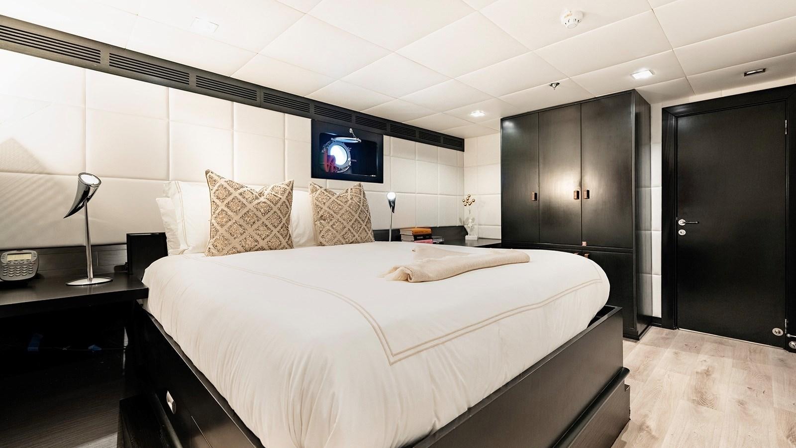 a large bedroom with a large bed aboard LOTUS Yacht for Sale