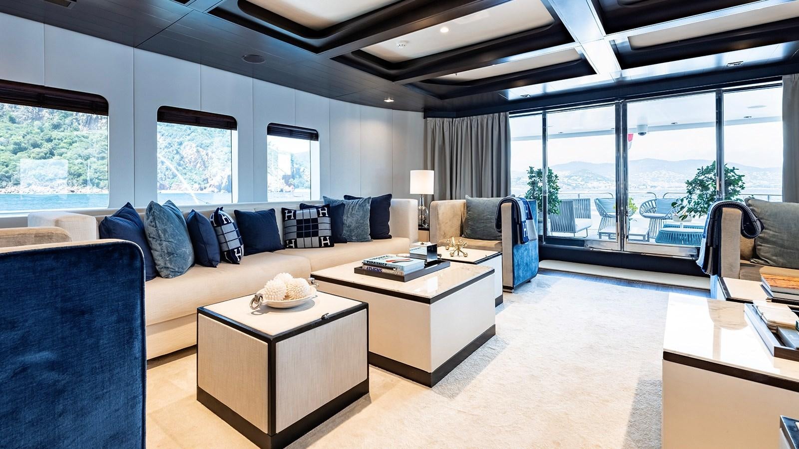 a living room with a large window aboard LOTUS Yacht for Sale