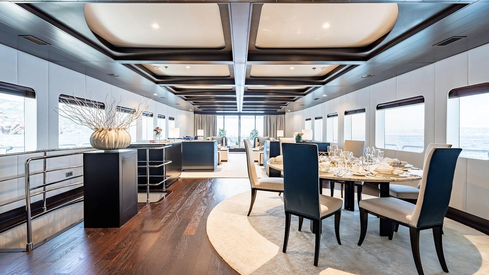 a modern kitchen with a large island aboard LOTUS Yacht for Sale