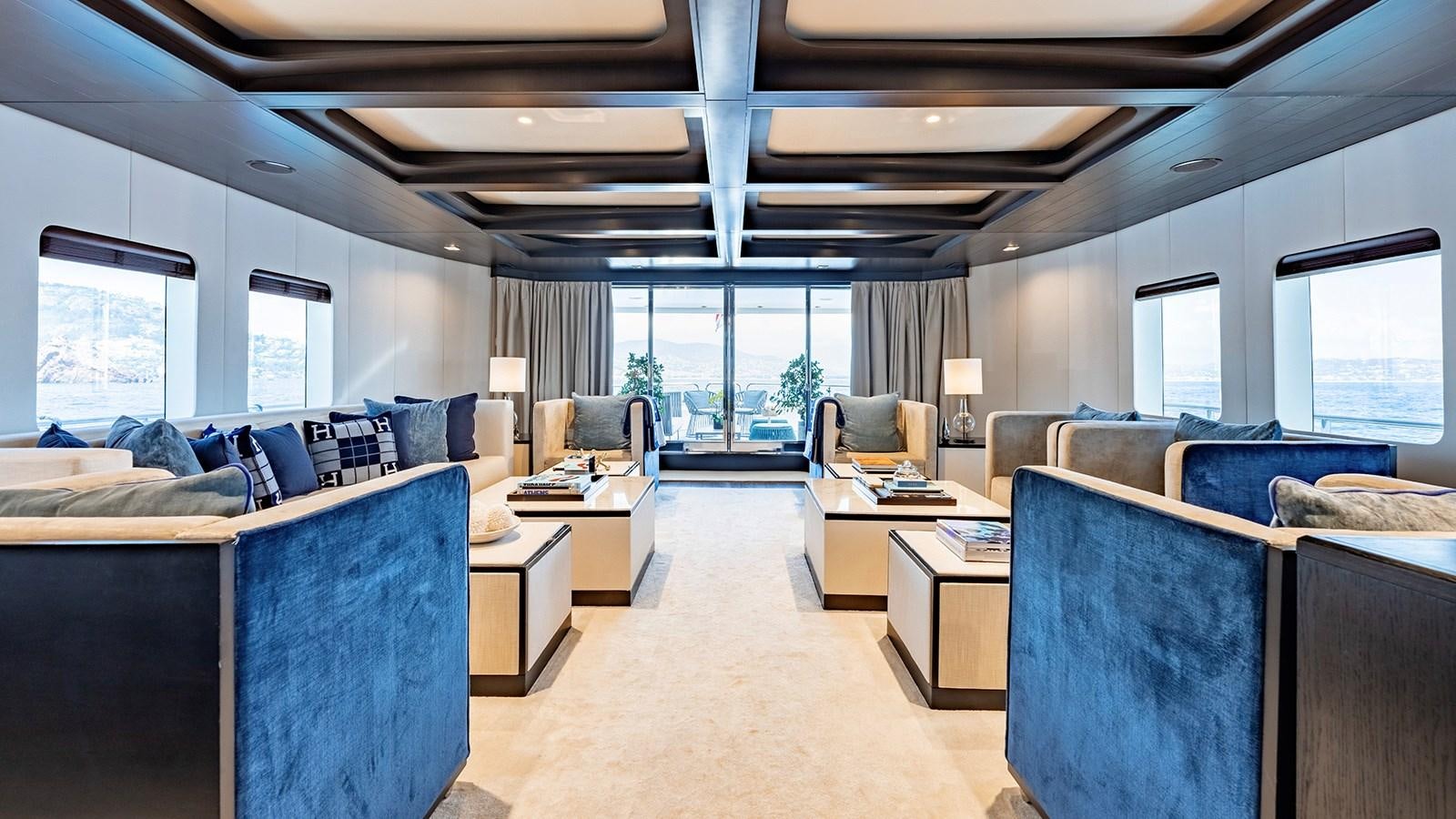 a living room with a large window aboard LOTUS Yacht for Sale