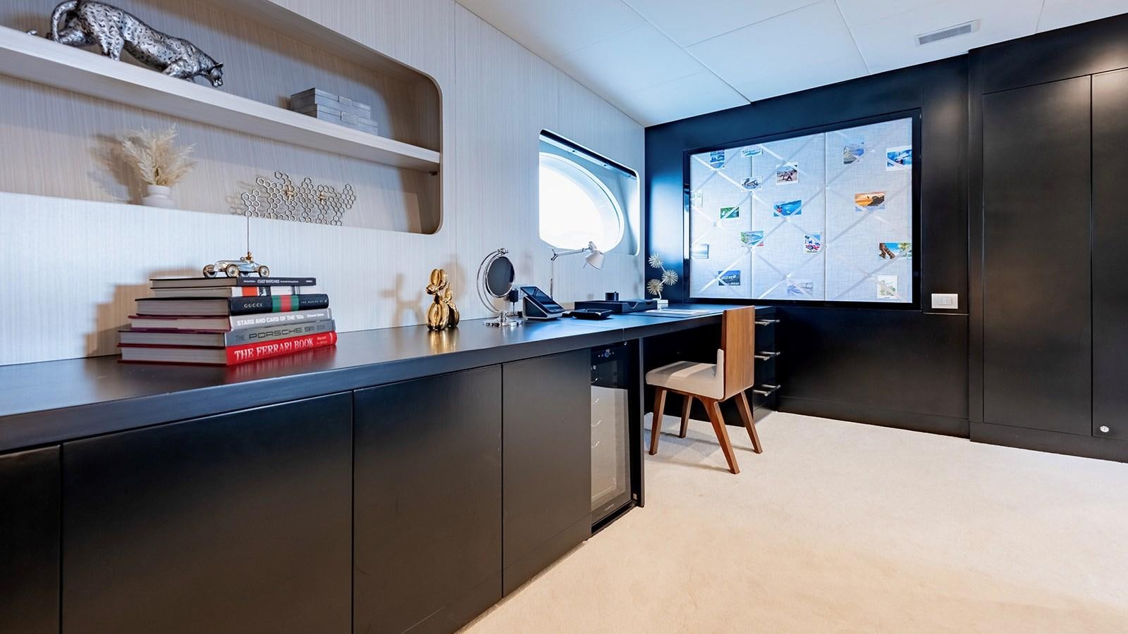 a kitchen with a large tv aboard LOTUS Yacht for Sale