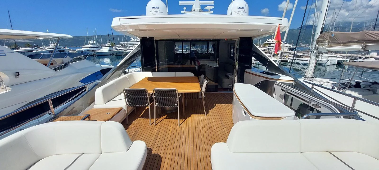 a boat with tables and chairs aboard PERLA Yacht for Sale