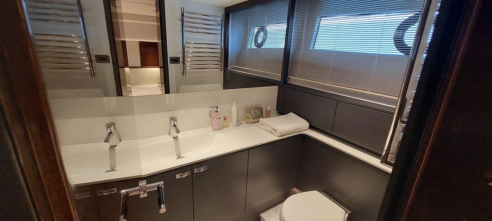 a bathroom with a sink and a mirror aboard PERLA Yacht for Sale