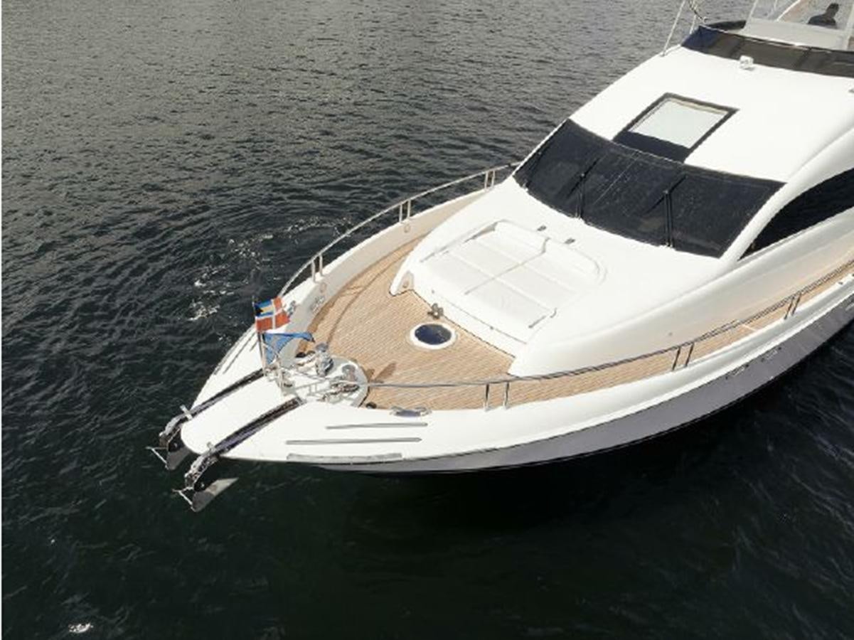 a white yacht in the water aboard 2007 LAZZARA 84 MOTOR Yacht for Sale
