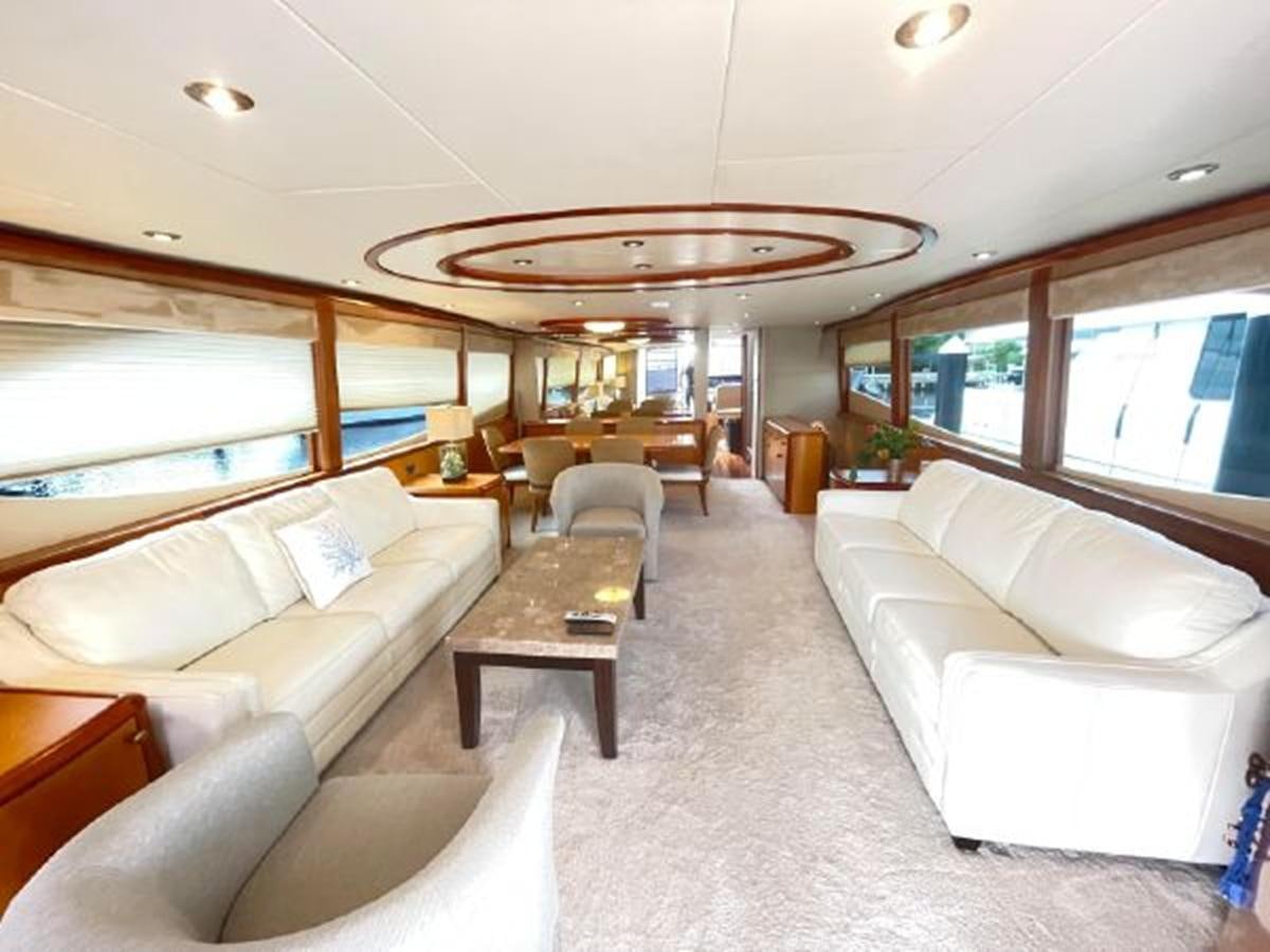a living room with a large window aboard 2007 LAZZARA 84 MOTOR Yacht for Sale