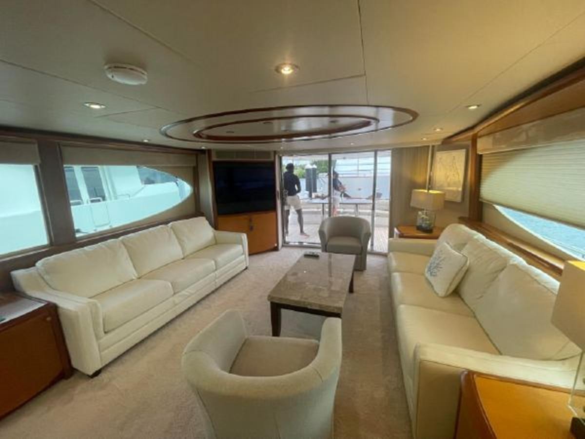 a living room with a large window aboard 2007 LAZZARA 84 MOTOR Yacht for Sale