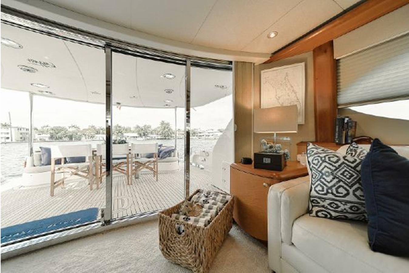 a living room with a large window aboard 2007 LAZZARA 84 MOTOR Yacht for Sale