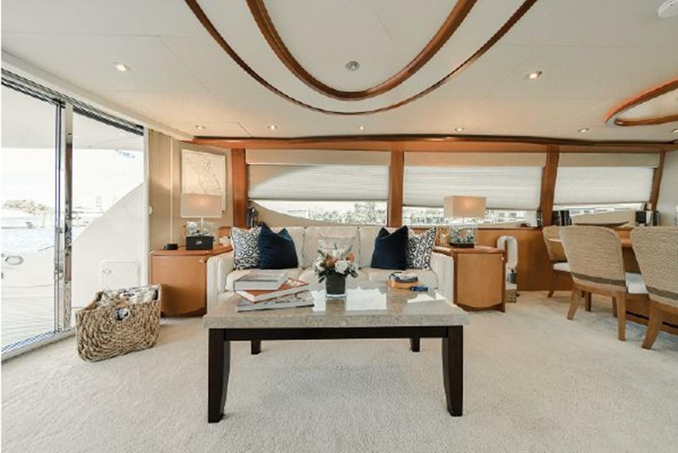 a living room with a large open window aboard 2007 LAZZARA 84 MOTOR Yacht for Sale