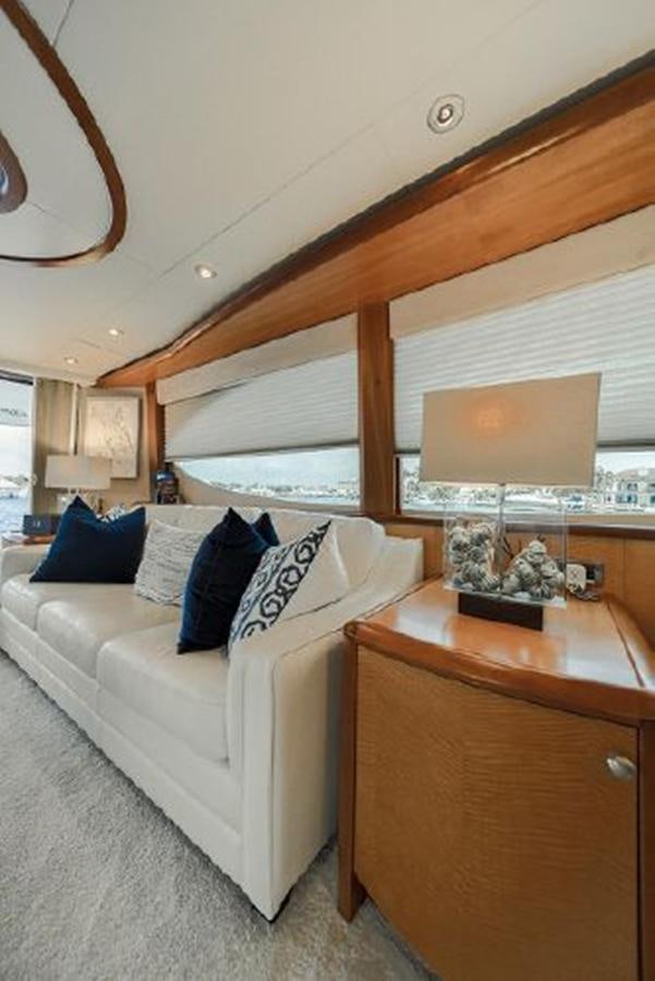 a living room with a couch and a table aboard 2007 LAZZARA 84 MOTOR Yacht for Sale