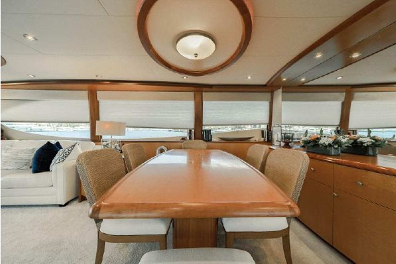 a kitchen with a table and chairs aboard 2007 LAZZARA 84 MOTOR Yacht for Sale