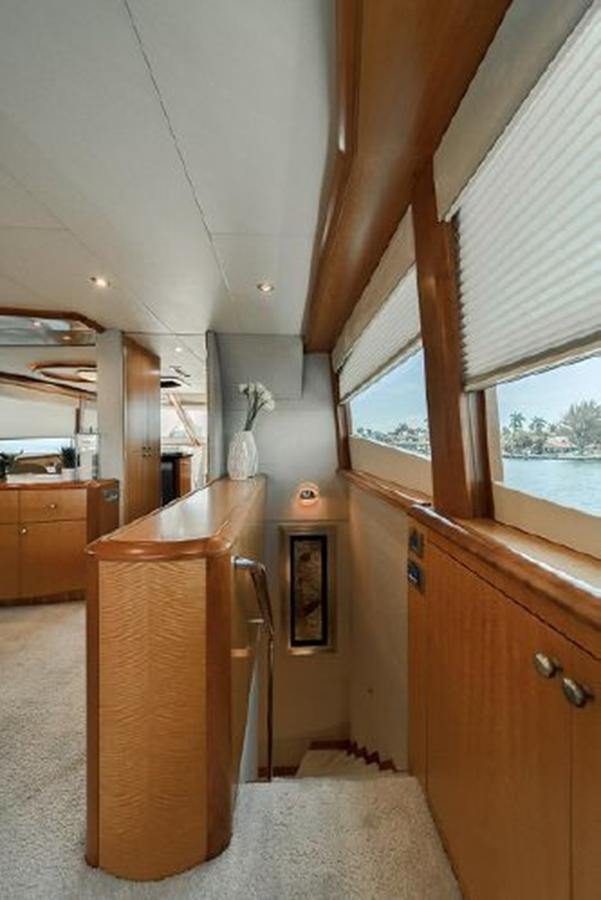 a kitchen with a wood counter aboard 2007 LAZZARA 84 MOTOR Yacht for Sale