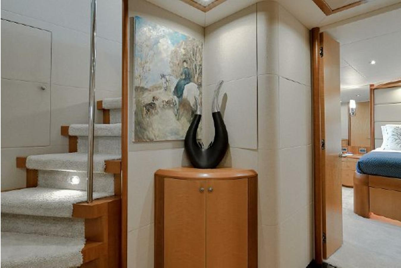 a room with a wood door and a wood cabinet aboard 2007 LAZZARA 84 MOTOR Yacht for Sale
