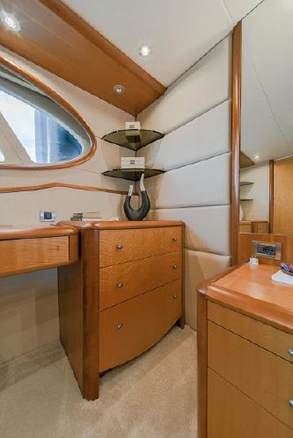 a wooden desk with a fan aboard 2007 LAZZARA 84 MOTOR Yacht for Sale