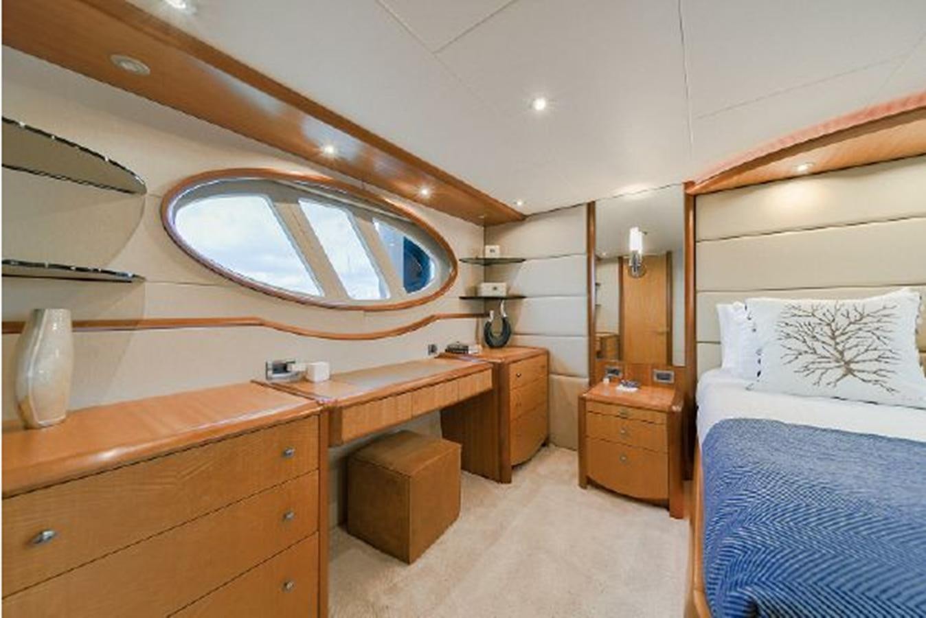 a room with a bed and a desk aboard 2007 LAZZARA 84 MOTOR Yacht for Sale
