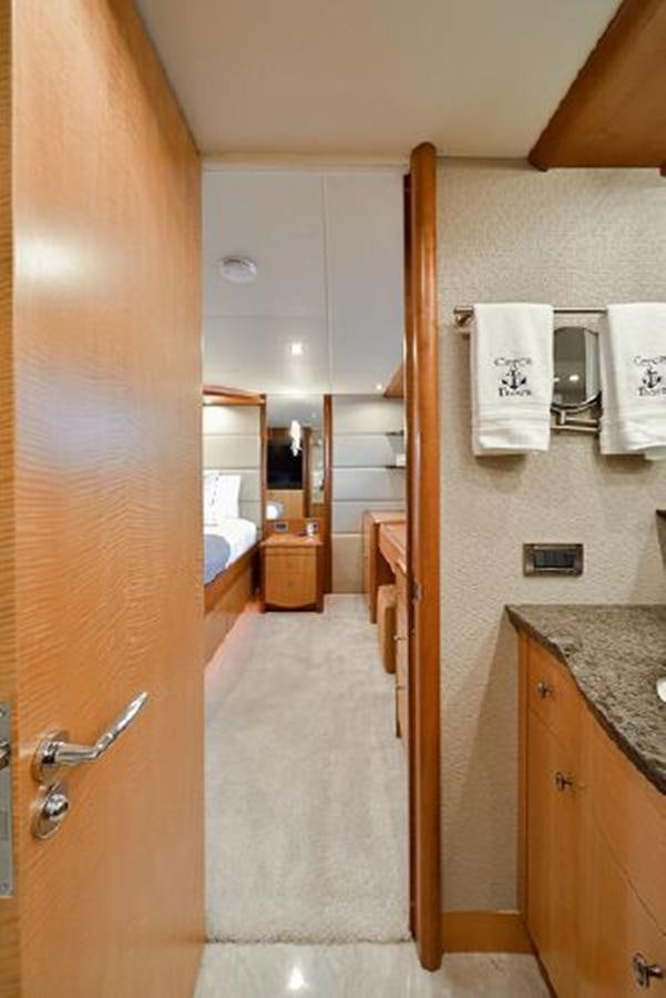 a bathroom with a shower and sink aboard 2007 LAZZARA 84 MOTOR Yacht for Sale