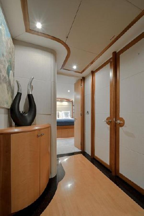 a room with a wood cabinet and doors aboard 2007 LAZZARA 84 MOTOR Yacht for Sale