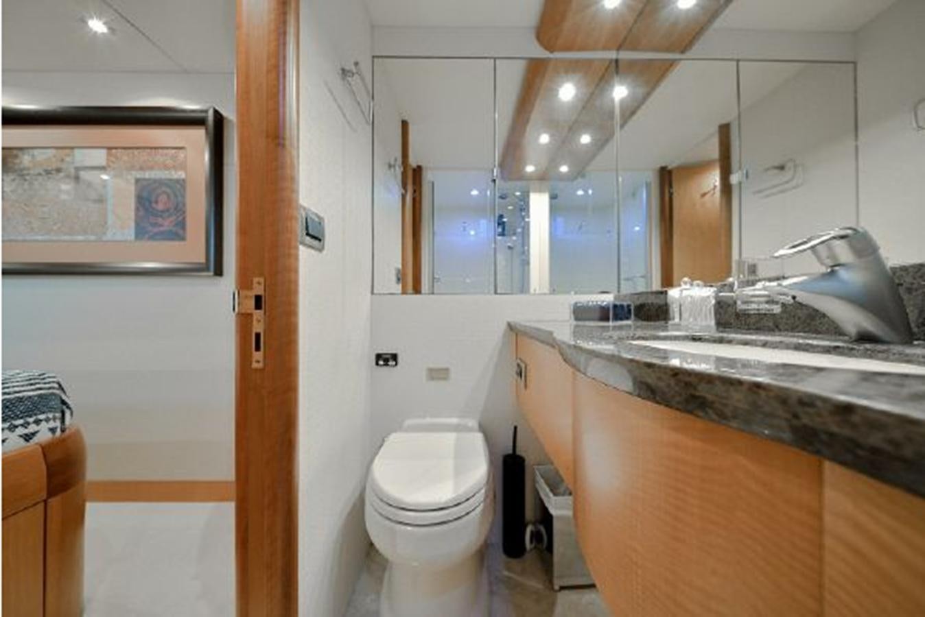 a bathroom with a sink toilet and a bathtub aboard 2007 LAZZARA 84 MOTOR Yacht for Sale
