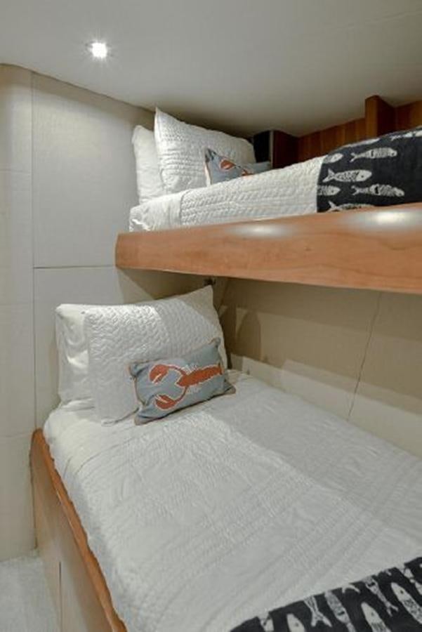 a bed with pillows aboard 2007 LAZZARA 84 MOTOR Yacht for Sale