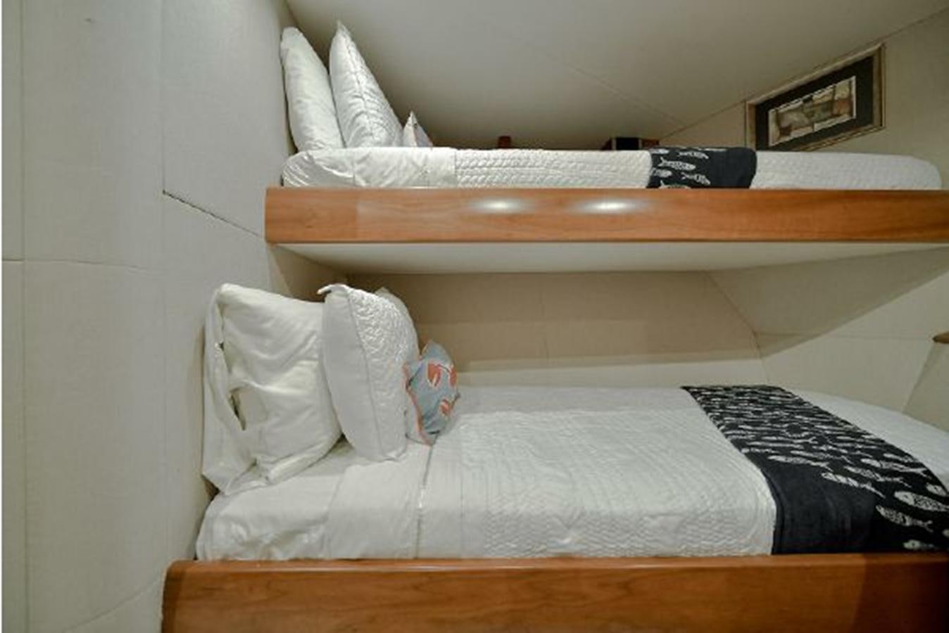 a bed with pillows aboard 2007 LAZZARA 84 MOTOR Yacht for Sale