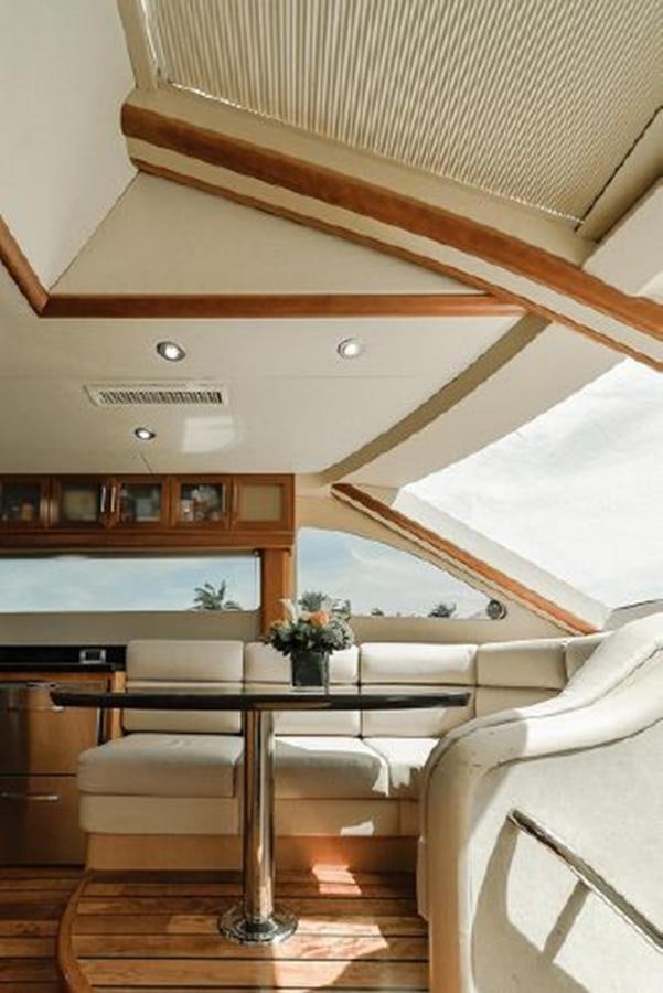 a room with a couch and a table aboard 2007 LAZZARA 84 MOTOR Yacht for Sale