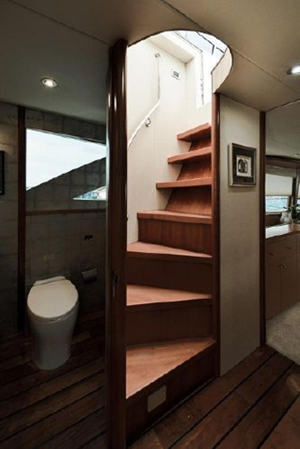 a wooden staircase in a bathroom aboard 2007 LAZZARA 84 MOTOR Yacht for Sale