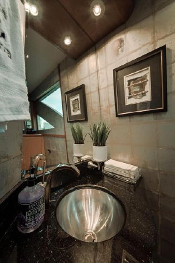 a sink in a bathroom aboard 2007 LAZZARA 84 MOTOR Yacht for Sale