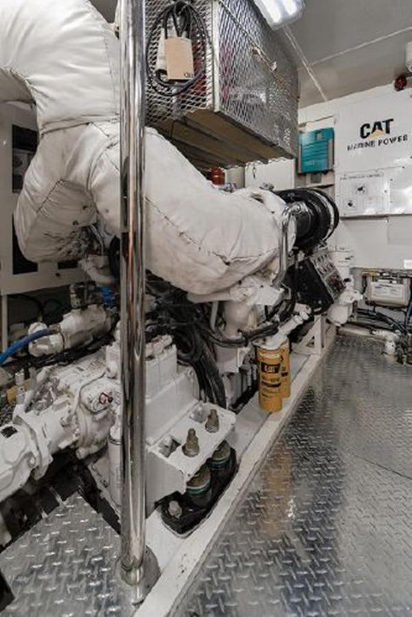 a person in a white coat aboard 2007 LAZZARA 84 MOTOR Yacht for Sale