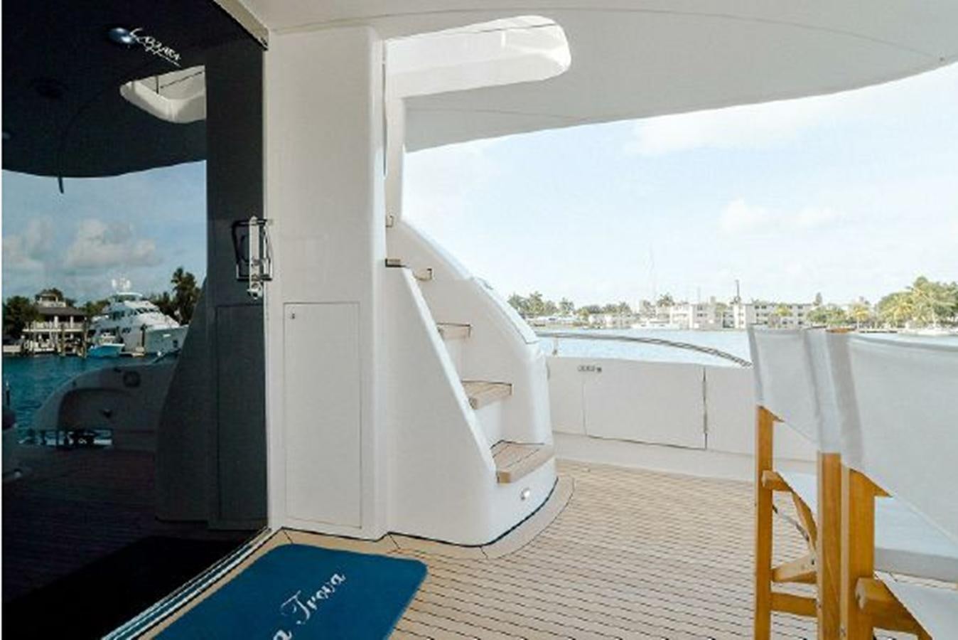 a white building with a balcony aboard 2007 LAZZARA 84 MOTOR Yacht for Sale